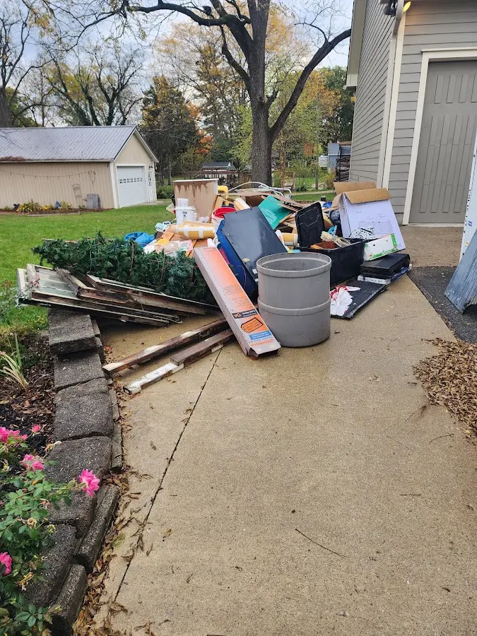 Dumpster being loaded with debris for Commercial Dumpster Rental in Humboldt
